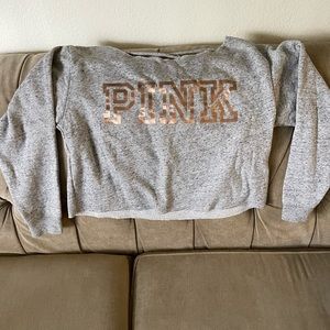 Pink sweat shirt.
